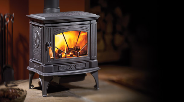 black wood stove with fire burning in it
