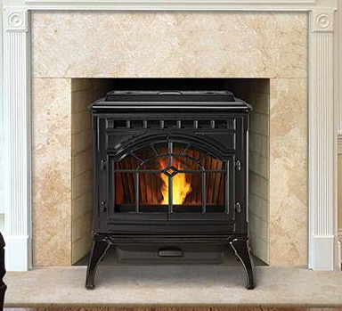 black wood stove with a tan hearth around it and white trim at the sides