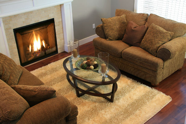 brown living room with gas fireplace