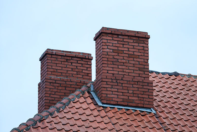Two red brick chimneys